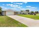 Long driveway leads to home with attached garage and extra parking at 2290 Carson Ln, Deltona, FL 32738