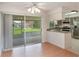 Modern kitchen featuring sleek appliances and open access to screened patio at 2290 Carson Ln, Deltona, FL 32738