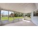 Screened lanai overlooking a lawn and landscaping at 2290 Carson Ln, Deltona, FL 32738