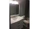 Bathroom featuring a white vanity with marble countertop, modern fixtures, and tiled shower and bath at 234 Afton Sq # 205, Altamonte Springs, FL 32714