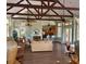 Spacious clubhouse interior with vaulted ceilings, ceiling fans, seating and a convenient kitchenette at 234 Afton Sq # 205, Altamonte Springs, FL 32714