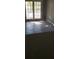 Living room featuring tile floors and natural light coming from the sliding glass doors to the balcony at 234 Afton Sq # 205, Altamonte Springs, FL 32714
