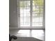 Living room featuring tile floors and natural light coming from the sliding glass doors to the balcony at 234 Afton Sq # 205, Altamonte Springs, FL 32714