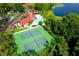 Aerial view of community clubhouse with pool and tennis courts surrounded by lush greenery at 236 Afton Sq # 309, Altamonte Springs, FL 32714