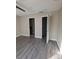 Spacious bedroom boasts wood-look flooring, two closets and adjoining bathroom at 236 Afton Sq # 309, Altamonte Springs, FL 32714