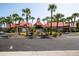 Oasis at Pearl Lake features a lovely community entrance surrounded by palm trees and landscaped with flowering bushes at 236 Afton Sq # 309, Altamonte Springs, FL 32714