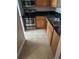 Compact kitchen features stainless steel appliances, granite countertops, and wood cabinetry at 236 Afton Sq # 309, Altamonte Springs, FL 32714