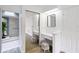 Bright bathroom with a vanity area and mirrored closet at 244 Surf Scooter Dr, Daytona Beach, FL 32119