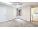 Bright bedroom with neutral carpet, ceiling fan, and door to other rooms at 244 Surf Scooter Dr, Daytona Beach, FL 32119