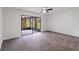 Bedroom with carpeted floor and large sliding glass doors at 244 Surf Scooter Dr, Daytona Beach, FL 32119