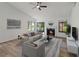 Cozy living room featuring a fireplace and sliding door access to the outdoors at 244 Surf Scooter Dr, Daytona Beach, FL 32119