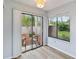 Brightly lit room with sliding glass doors that give access to the outdoors at 244 Surf Scooter Dr, Daytona Beach, FL 32119