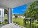 Balcony view of a lake and lawn at 2533 Grassy Point Dr # 215, Lake Mary, FL 32746
