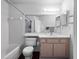 Bright bathroom featuring a bathtub and vanity with wood cabinets at 2533 Grassy Point Dr # 215, Lake Mary, FL 32746