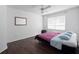 Bedroom featuring a ceiling fan, a window, and wood floor at 2533 Grassy Point Dr # 215, Lake Mary, FL 32746
