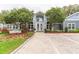 Inviting clubhouse exterior with manicured landscaping and ample parking, showcasing a welcoming community space at 2533 Grassy Point Dr # 215, Lake Mary, FL 32746