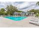 Sparkling community pool with ample seating, offering a refreshing oasis for relaxation and leisure at 2533 Grassy Point Dr # 215, Lake Mary, FL 32746