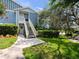 Charming two-story condo with well-maintained landscaping and a welcoming entrance at 2533 Grassy Point Dr # 215, Lake Mary, FL 32746