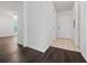 Inviting foyer with dark wood floors that transition to tile near the front door at 2533 Grassy Point Dr # 215, Lake Mary, FL 32746