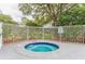 Secluded hot tub area surrounded by lush landscaping, offering a tranquil and private retreat for relaxation at 2533 Grassy Point Dr # 215, Lake Mary, FL 32746