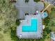 Aerial view of a sparkling community pool with lounge chairs and manicured landscaping at 2533 Grassy Point Dr # 215, Lake Mary, FL 32746