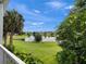 Scenic water view featuring a serene lake surrounded by lush greenery and clear blue skies at 2533 Grassy Point Dr # 215, Lake Mary, FL 32746