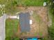 Aerial view showcases the house surrounded by grassy areas within its property lines at 2549 Gress Ln, Lakeland, FL 33805