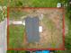 Aerial view showcases the house surrounded by grassy areas within its property lines at 2549 Gress Ln, Lakeland, FL 33805