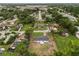 Aerial view of the house nestled within a tree-lined neighborhood, showcasing its location at 2549 Gress Ln, Lakeland, FL 33805