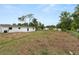 Expansive backyard featuring lush greenery and ample space for outdoor activities and landscaping possibilities at 2549 Gress Ln, Lakeland, FL 33805