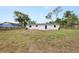 Wide view of the home's backyard, showcasing the potential for outdoor living and entertainment at 2549 Gress Ln, Lakeland, FL 33805
