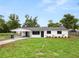 Beautifully renovated single-story home with an expansive front lawn and covered parking at 2549 Gress Ln, Lakeland, FL 33805