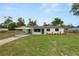 Charming home with a well-maintained lawn and a covered carport for convenient parking at 2549 Gress Ln, Lakeland, FL 33805