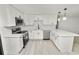 Modern kitchen featuring stainless steel appliances, stylish cabinetry, and quartz countertops at 2549 Gress Ln, Lakeland, FL 33805