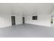 Spacious covered patio with painted concrete floor, perfect for outdoor entertaining at 2549 Gress Ln, Lakeland, FL 33805