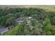 Located in a wooded area, the home boasts ample space and is surrounded by nature, offering a serene living environment at 2597 Cr 426F, Lake Panasoffkee, FL 33538