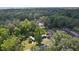 The property boasts a spacious lot, mature trees, and is located in a serene, wooded area with lots of privacy at 2597 Cr 426F, Lake Panasoffkee, FL 33538