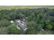 The property features a private lot surrounded by mature trees, and is located in a serene and lush wooded neighborhood at 2597 Cr 426F, Lake Panasoffkee, FL 33538