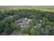 Nestled within lush foliage, the home enjoys a serene environment, with ample space and access to natural beauty at 2597 Cr 426F, Lake Panasoffkee, FL 33538