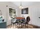 A shot of the eat-in dining area, with a large window and space for four at 2597 Cr 426F, Lake Panasoffkee, FL 33538
