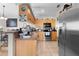 Open kitchen with stainless steel appliances and ample counter space, perfect for cooking at 2597 Cr 426F, Lake Panasoffkee, FL 33538
