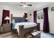 This is a shot of the main bedroom, with an accent wall, nice floors and an inviting setup at 2597 Cr 426F, Lake Panasoffkee, FL 33538