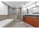 Modern bathroom features a soaking tub, glass shower, and double vanity at 260 S Osceola Ave # 1406, Orlando, FL 32801
