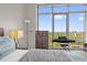 Bright bedroom featuring a piano, expansive windows and scenic views at 260 S Osceola Ave # 1406, Orlando, FL 32801