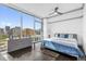 Bedroom with a city view, hardwood floors and simple modern furnishings at 260 S Osceola Ave # 1406, Orlando, FL 32801
