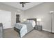 Cozy bedroom with plush carpet and a well-lit bathroom in view at 260 S Osceola Ave # 1406, Orlando, FL 32801