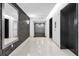 Elegant hallway with modern wallpaper, an exit sign, and elevator access, leading to residential units at 260 S Osceola Ave # 1406, Orlando, FL 32801
