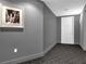 Hallway view leading to unit 1406, with a black and white photo adding a touch of classic decor at 260 S Osceola Ave # 1406, Orlando, FL 32801
