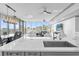 Modern kitchen with a large island, sleek countertops, stainless steel appliances, and stunning city views at 260 S Osceola Ave # 1406, Orlando, FL 32801
