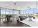 Spacious living and dining area featuring floor-to-ceiling windows with views, a piano, and modern lighting at 260 S Osceola Ave # 1406, Orlando, FL 32801